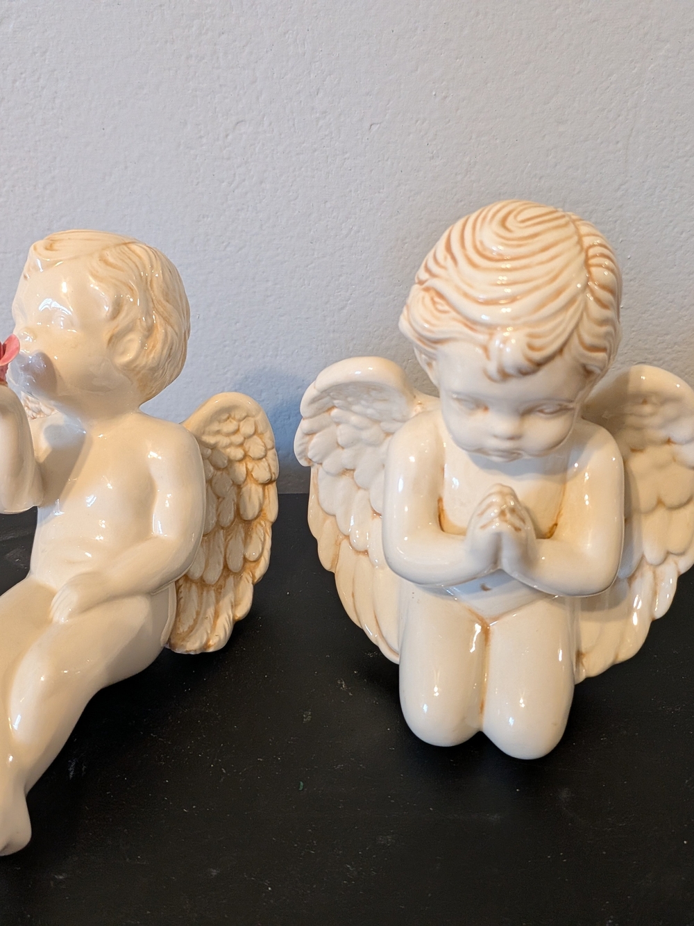 Two Vintage Cherub Glazed Angels. One Praying, One Sitting Blowing A Kiss